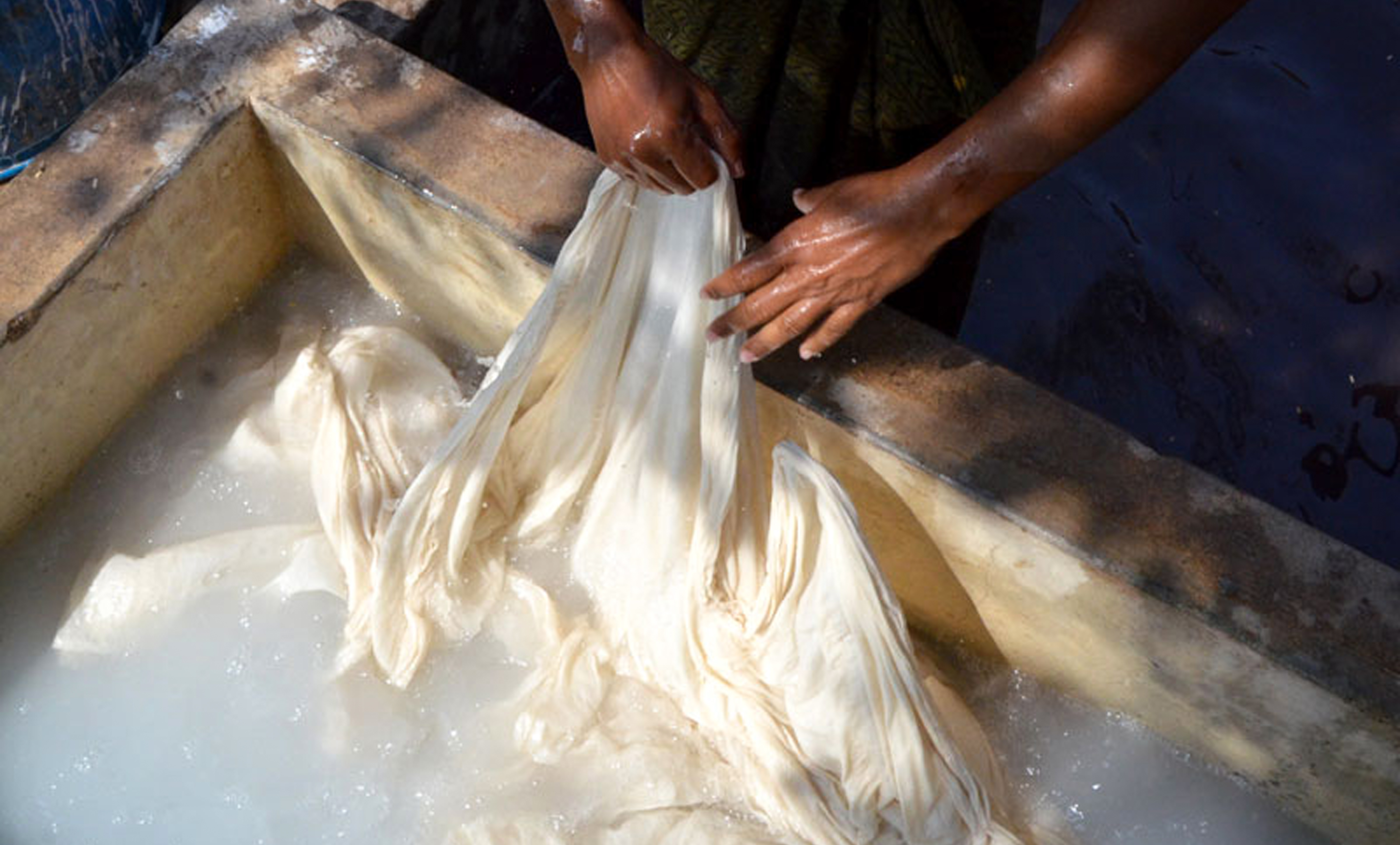 Fabric is washed, stretched, and pinned before printing.