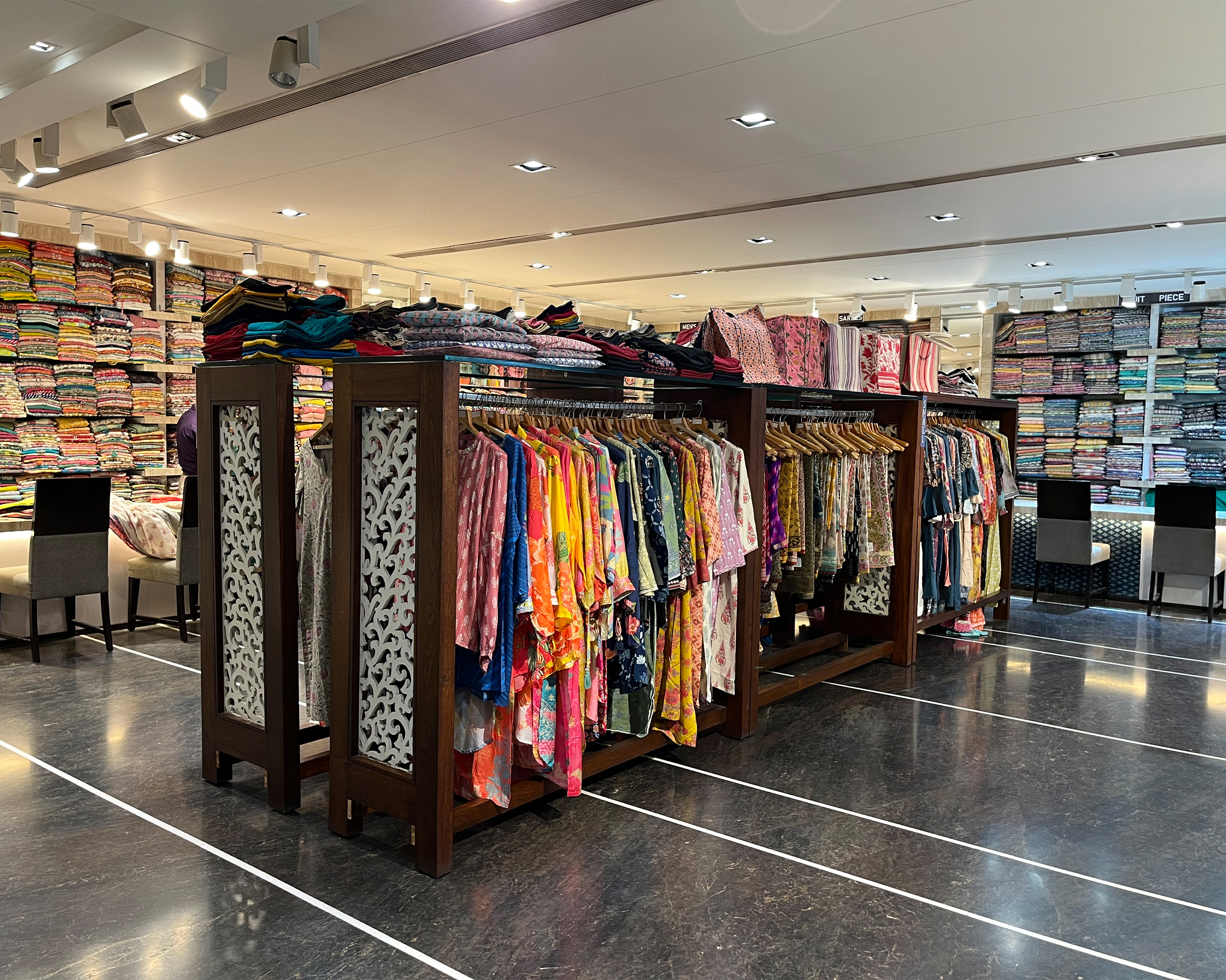 Cott-Fab Creations clothing racks and printed garments